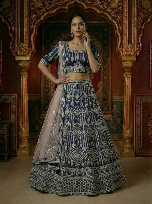 Royal Blue Silk Lehenga with Silver Embroidered Blouse & Rust Net Dupatta